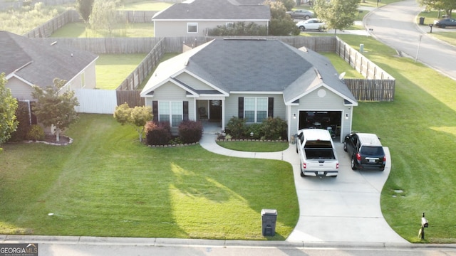 view of front of property featuring concrete driveway and a garage