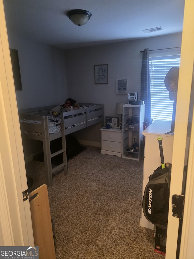 bedroom featuring carpet