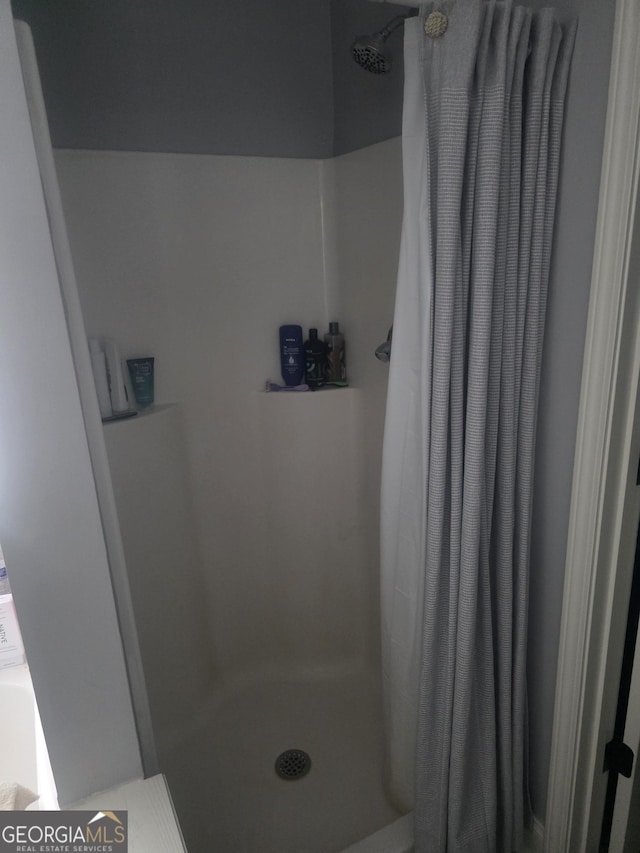 bathroom with curtained shower