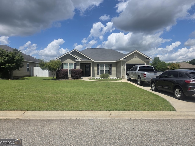 view of front of property with a garage, driveway, and a front yard