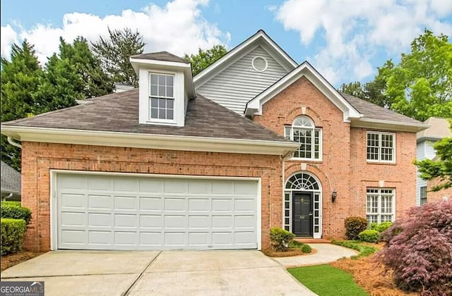 232 Spalding Gates Dr, Atlanta, GA 30328 - view of front facade with brick siding, driveway, and roof with shingles