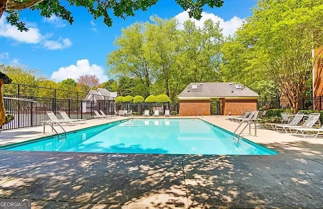 232 Spalding Gates Dr, Atlanta, GA 30328 - community pool featuring a patio area and fence