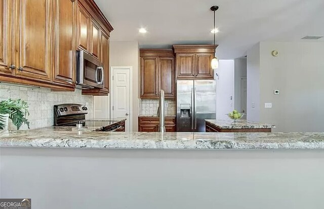 232 Spalding Gates Dr, Atlanta, GA 30328 - kitchen featuring stainless steel appliances, light stone countertops, decorative backsplash, pendant lighting, and brown cabinetry