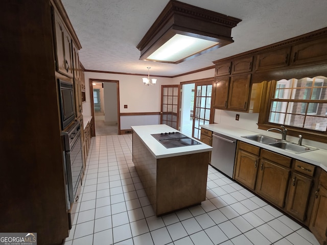 2451 Old Salem Cir SE, Conyers, GA 30013 - kitchen with a sink, black appliances, a center island, light countertops, and light tile patterned floors