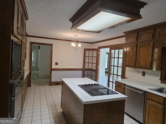 2451 Old Salem Cir SE, Conyers, GA 30013 - kitchen featuring black appliances, light tile patterned floors, a textured ceiling, a chandelier, and light countertops