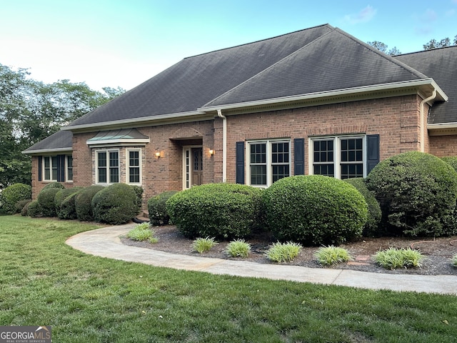2451 Old Salem Cir SE, Conyers, GA 30013 - view of front of property featuring a front lawn, brick siding, and roof with shingles