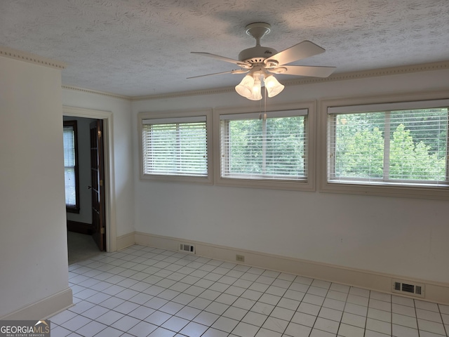2451 Old Salem Cir SE, Conyers, GA 30013 - empty room with baseboards, ceiling fan, light tile patterned flooring, and a textured ceiling
