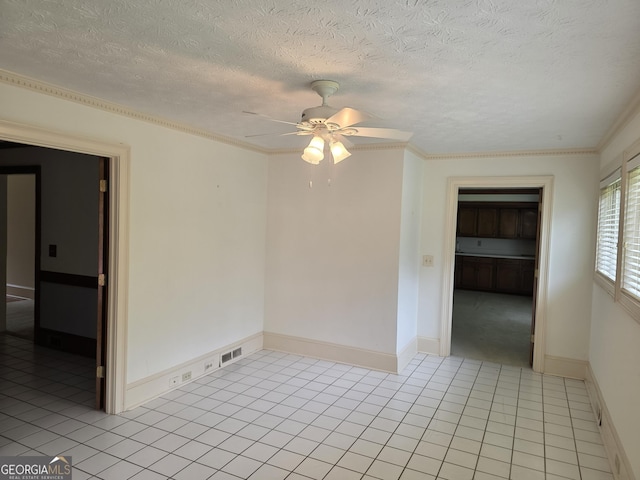 2451 Old Salem Cir SE, Conyers, GA 30013 - spare room featuring ceiling fan, light tile patterned floors, a textured ceiling, and baseboards