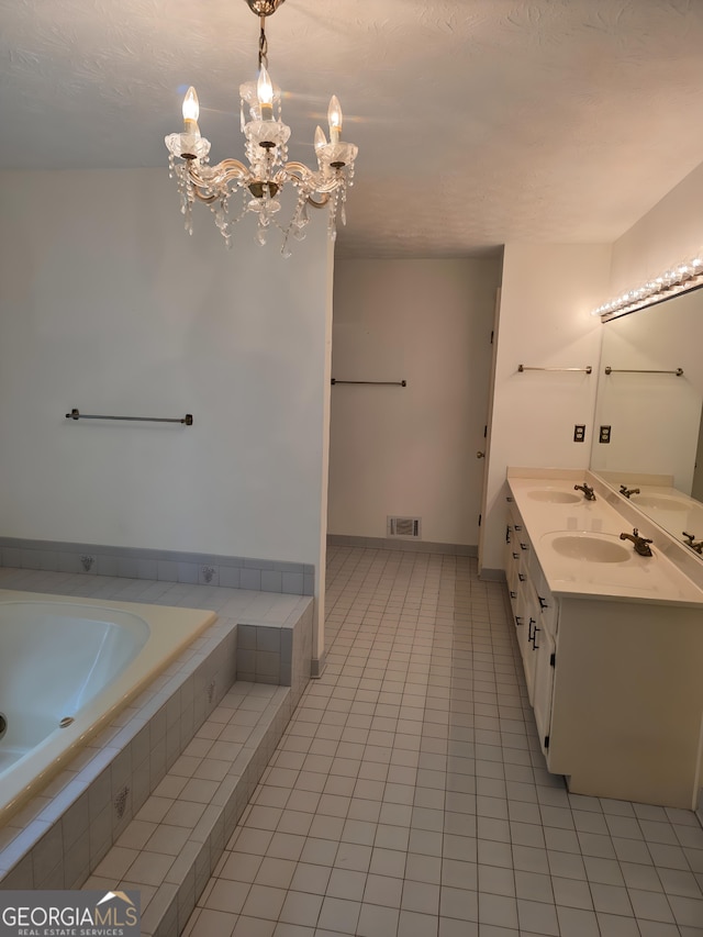 2451 Old Salem Cir SE, Conyers, GA 30013 - bathroom with tile patterned flooring, double vanity, a bath, and a chandelier