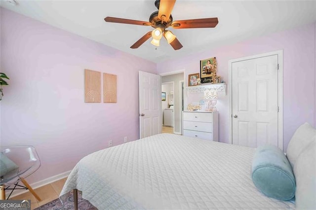 bedroom with baseboards and ceiling fan