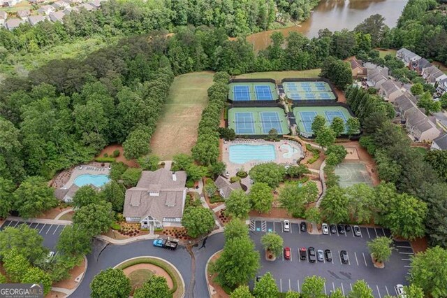 aerial overview of property's location with a pool area and a large body of water