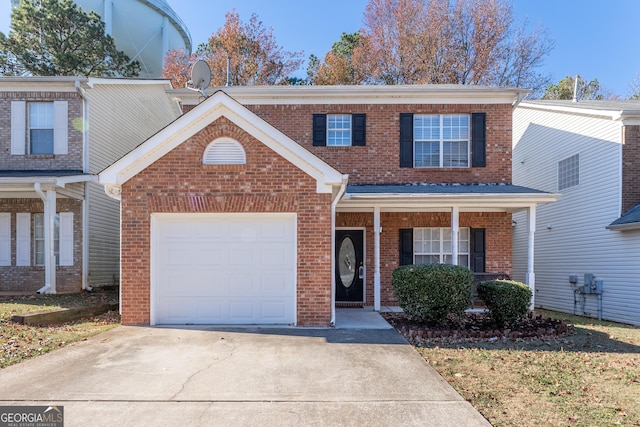 538 Shadowmoore Dr, Riverdale, GA 30274 - traditional-style home with brick siding, concrete driveway, a porch, and a garage