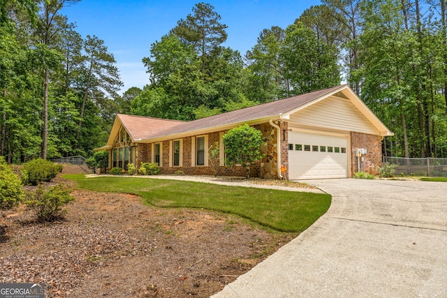 ranch-style house featuring a garage, driveway, and brick siding