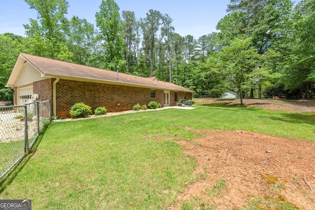 view of yard with an attached garage