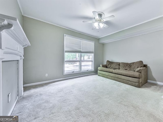 carpeted living area featuring crown molding, ceiling fan, and baseboards