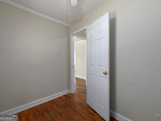 6296 Longino Dr, Union City, GA 30291 - empty room featuring baseboards, dark wood-style floors, ornamental molding, and a textured ceiling
