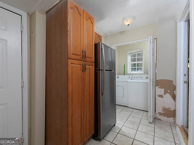 6296 Longino Dr, Union City, GA 30291 - washroom featuring separate washer and dryer and light tile patterned floors
