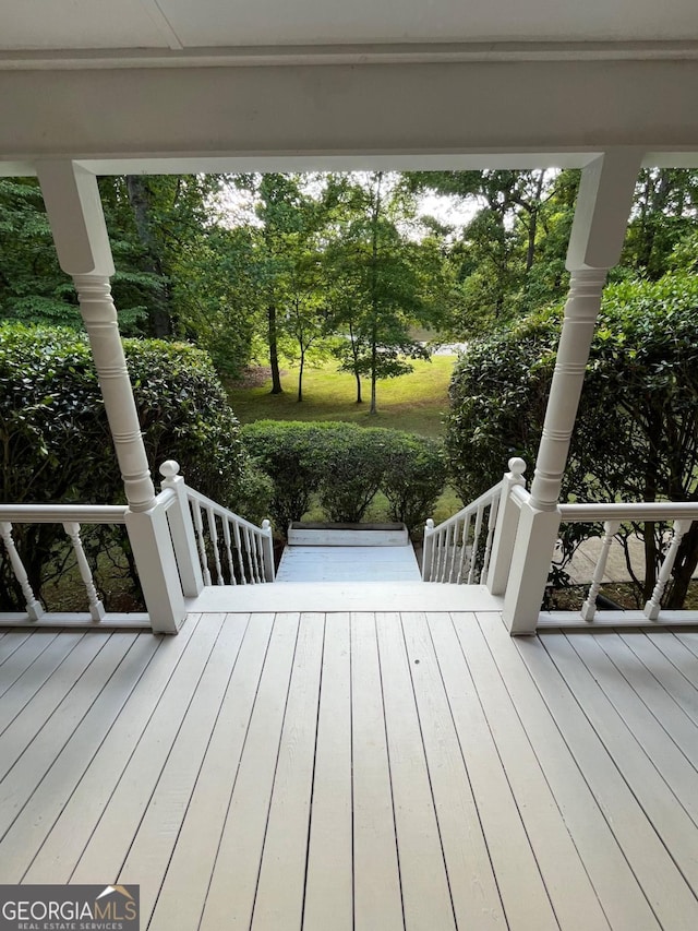 wooden terrace featuring covered porch