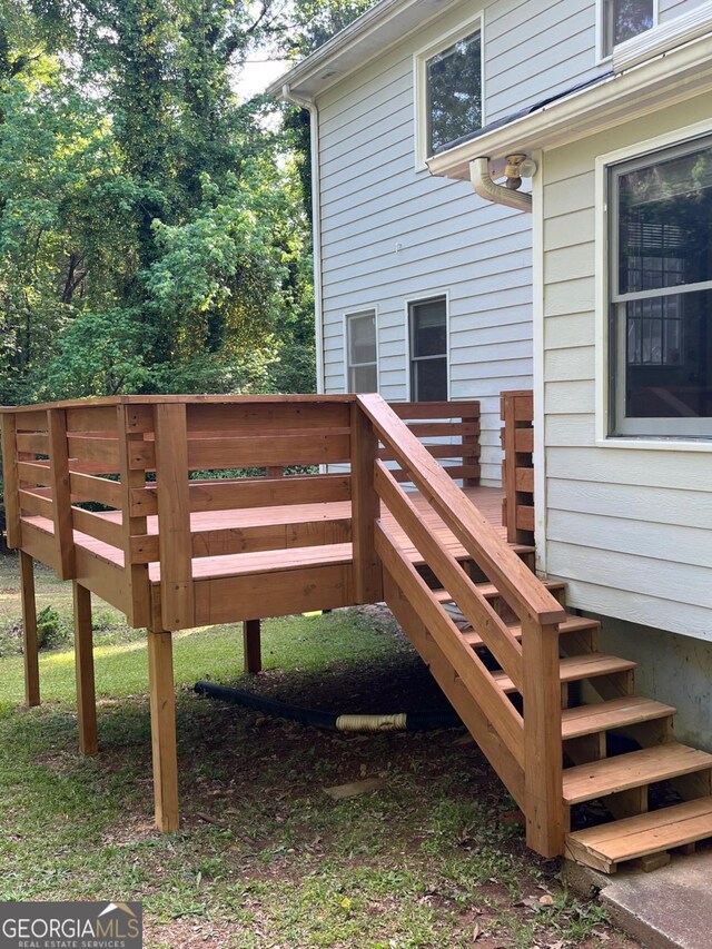 wooden deck featuring stairs
