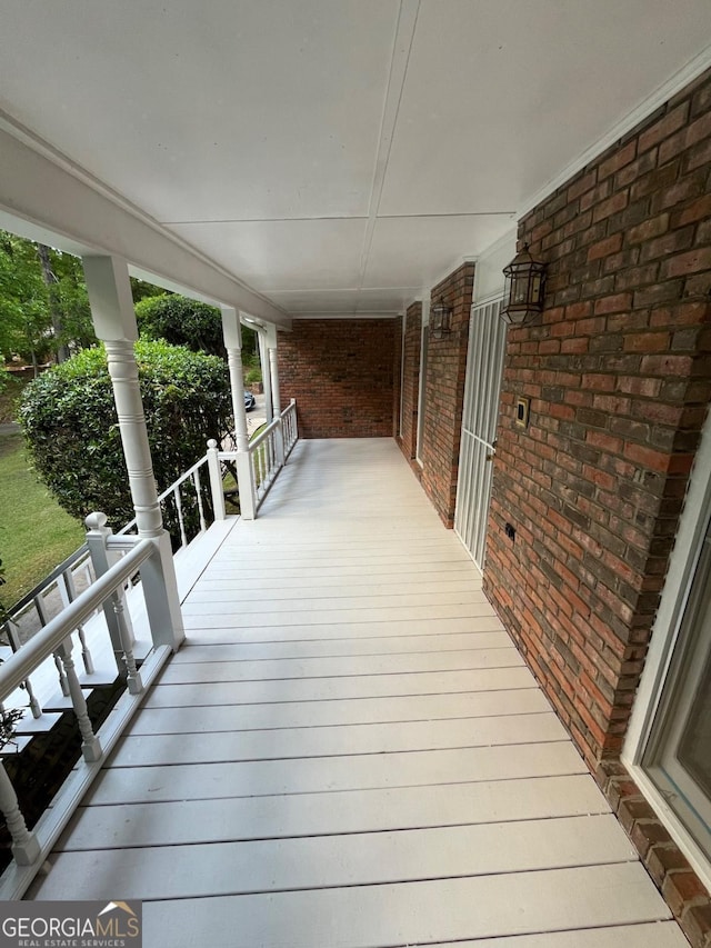 wooden terrace featuring a porch