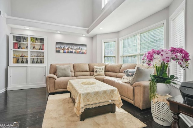 4125 Fallbrook Dr, Duluth, GA 30096 - living room featuring dark wood-style flooring, a high ceiling, and recessed lighting