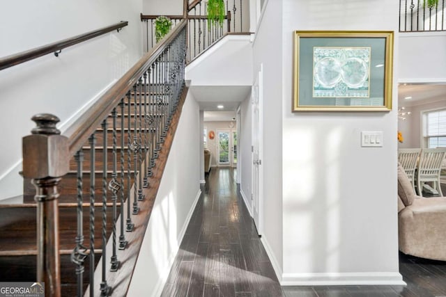 4125 Fallbrook Dr, Duluth, GA 30096 - stairs with wood finished floors, baseboards, and a towering ceiling