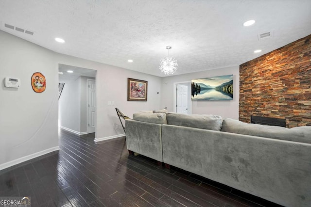 4125 Fallbrook Dr, Duluth, GA 30096 - living room with baseboards, dark wood-type flooring, a fireplace, recessed lighting, and a chandelier