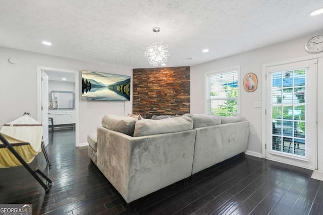 4125 Fallbrook Dr, Duluth, GA 30096 - living room featuring baseboards, dark wood-type flooring, a textured ceiling, recessed lighting, and a chandelier