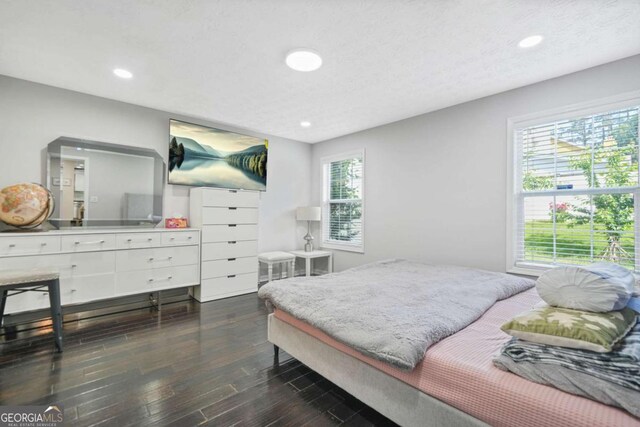 4125 Fallbrook Dr, Duluth, GA 30096 - bedroom with dark wood-style flooring and recessed lighting