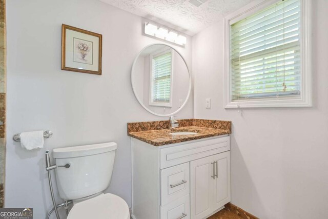 4125 Fallbrook Dr, Duluth, GA 30096 - bathroom featuring toilet and vanity