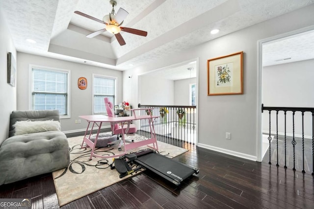 4125 Fallbrook Dr, Duluth, GA 30096 - workout room featuring baseboards, ceiling fan, a raised ceiling, wood finished floors, and recessed lighting