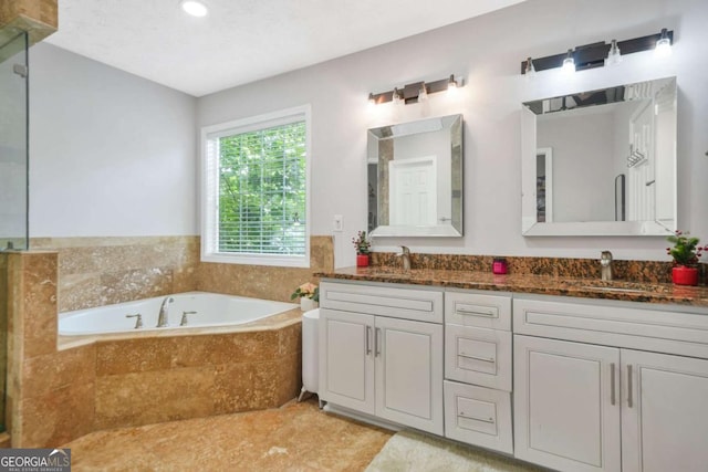 4125 Fallbrook Dr, Duluth, GA 30096 - full bath with a garden tub, double vanity, and recessed lighting