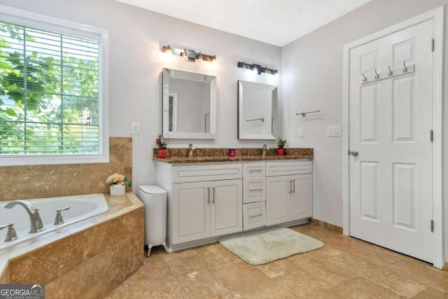 4125 Fallbrook Dr, Duluth, GA 30096 - full bathroom featuring healthy amount of natural light, a garden tub, and double vanity