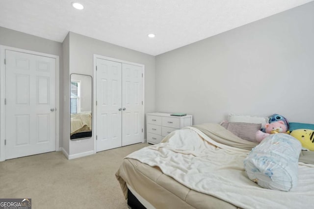4125 Fallbrook Dr, Duluth, GA 30096 - bedroom featuring light carpet, a closet, recessed lighting, and baseboards