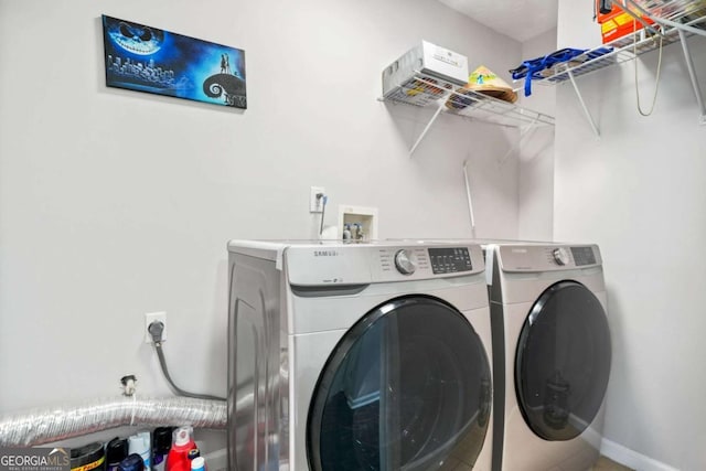 4125 Fallbrook Dr, Duluth, GA 30096 - clothes washing area featuring washing machine and clothes dryer and baseboards
