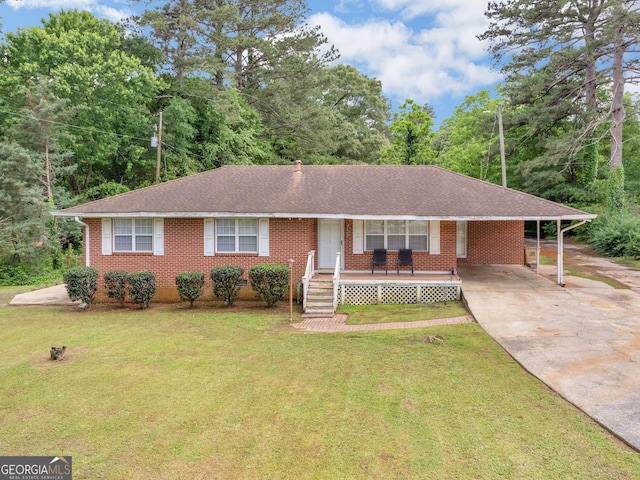 2609 Lake Harbin Rd, Morrow, GA 30260 - ranch-style house with concrete driveway, a front lawn, brick siding, and a carport