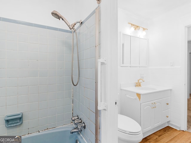 2609 Lake Harbin Rd, Morrow, GA 30260 - full bathroom with vanity, toilet, shower / bathtub combination, and wood finished floors