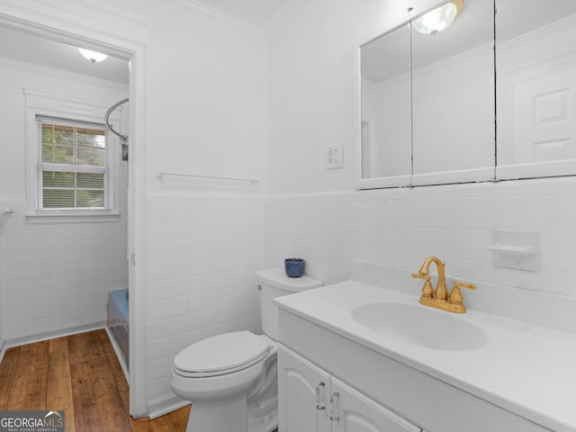 2609 Lake Harbin Rd, Morrow, GA 30260 - bathroom with tile walls, hardwood / wood-style floors, vanity, toilet, and a wainscoted wall