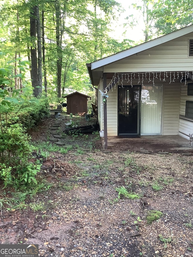 961 Mountain Shadows Dr, Cleveland, GA 30528 - view of yard featuring a shed, an outbuilding, and a porch