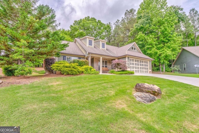 view of front of house with a garage, driveway, a front yard, and a porch