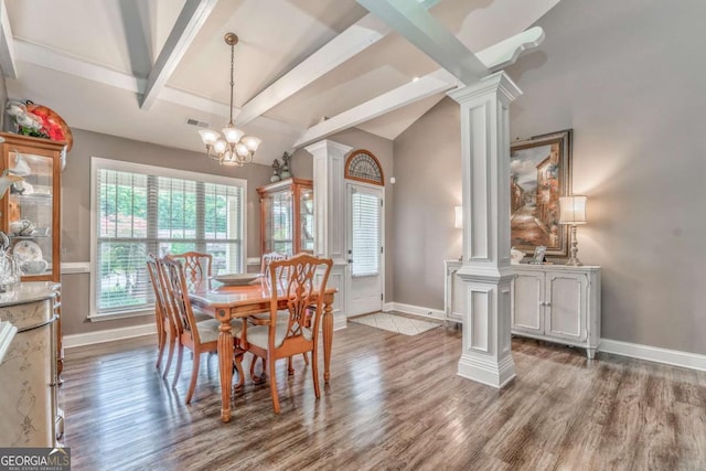 dining area featuring decorative columns, wood finished floors, and baseboards