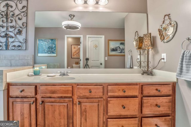 bathroom featuring toilet and vanity