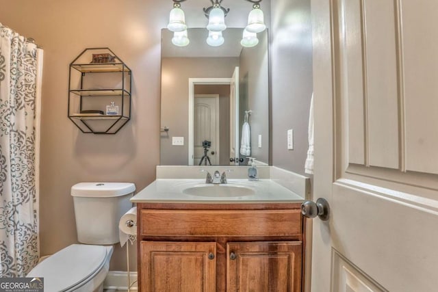 bathroom with vanity and toilet