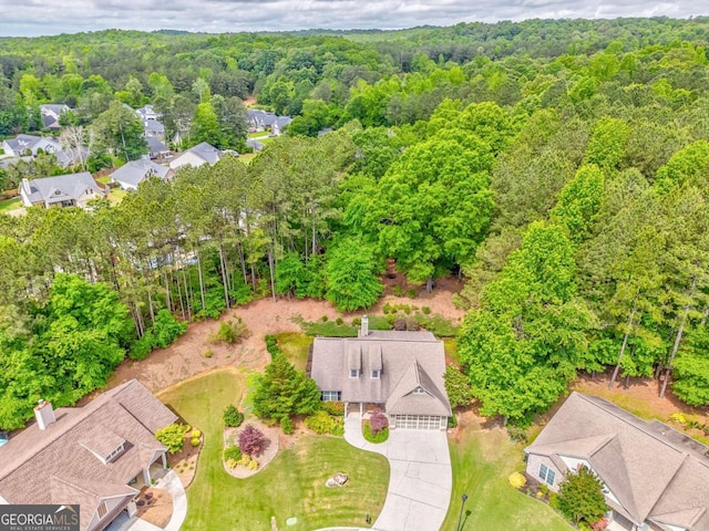 aerial view of residential area with a forest