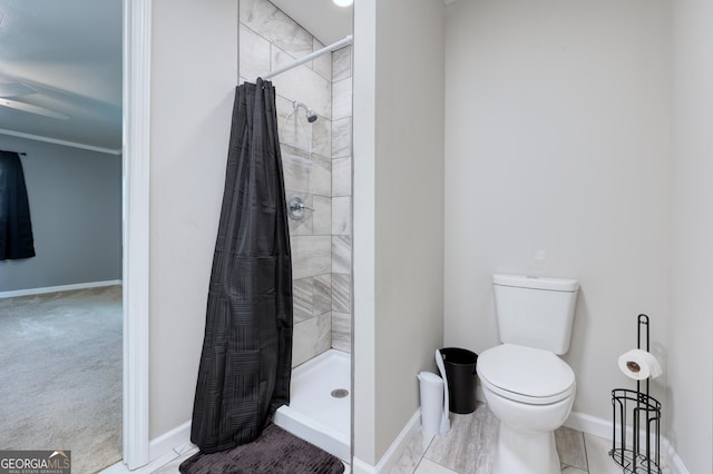 132 Jefferson Dr, Columbus, GA 31907 - bathroom with a stall shower, baseboards, toilet, and a ceiling fan