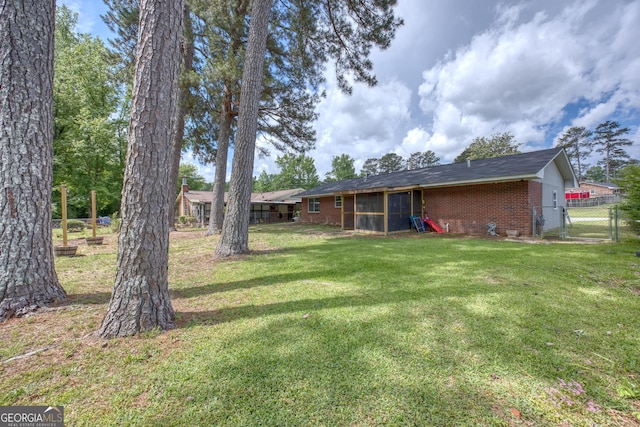 132 Jefferson Dr, Columbus, GA 31907 - view of yard featuring a gate and a sunroom