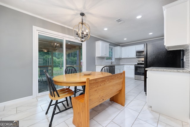 132 Jefferson Dr, Columbus, GA 31907 - dining space with light marble finish flooring, a chandelier, recessed lighting, ornamental molding, and baseboards