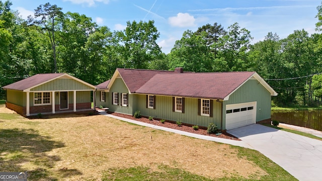 3340 Zingara Rd, Conyers, GA 30012 - ranch-style house featuring a porch, a front yard, a chimney, concrete driveway, and roof with shingles