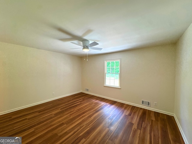 3340 Zingara Rd, Conyers, GA 30012 - empty room with dark wood-type flooring, baseboards, and a ceiling fan