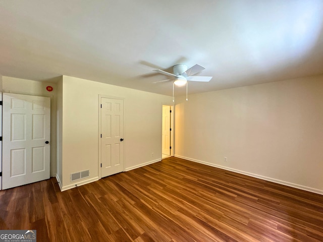 3340 Zingara Rd, Conyers, GA 30012 - unfurnished bedroom with dark wood-style flooring, baseboards, and ceiling fan